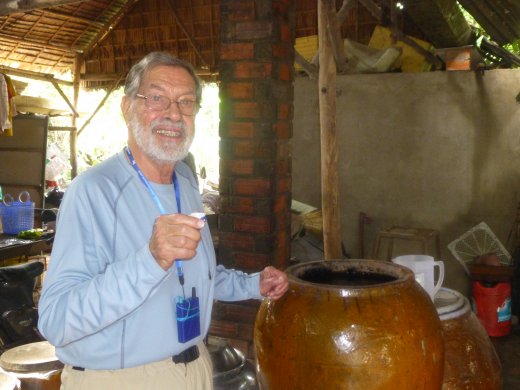 Cai Be.Ed sipping rice wine