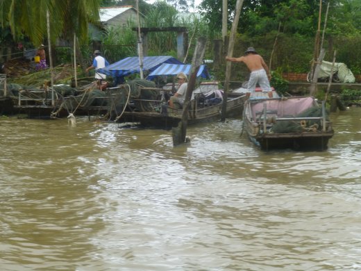Cai Be.Fishermen returning