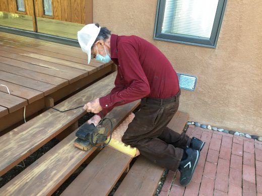 Ed sanding the deck stairs
